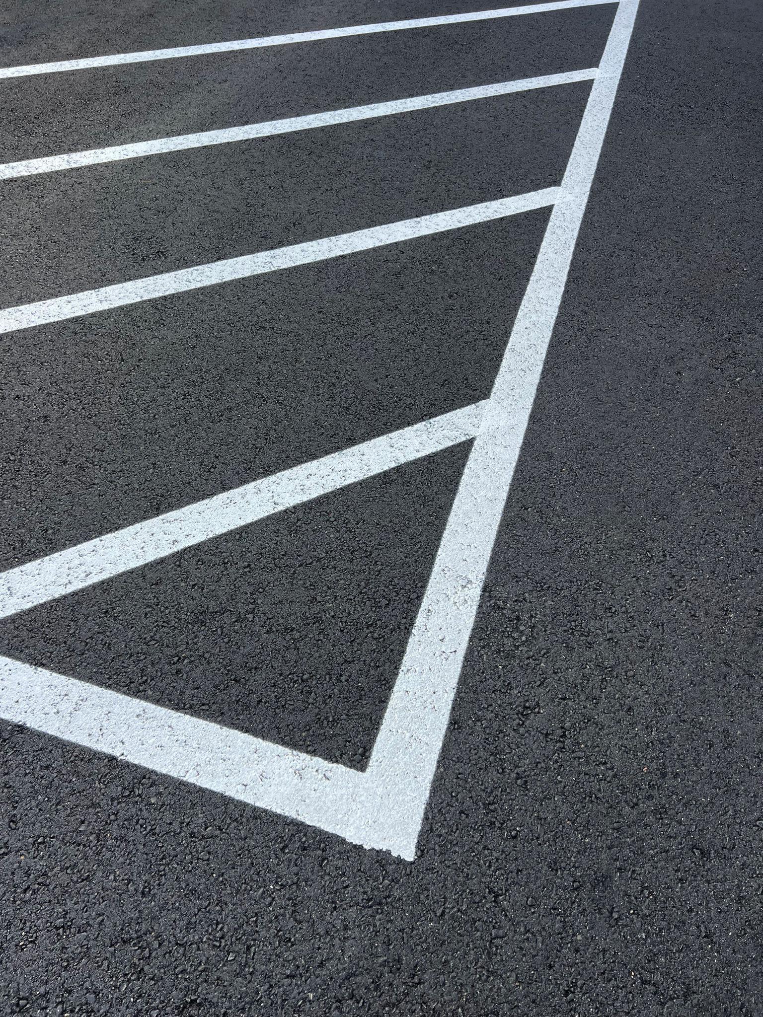 Parking lot striping closeup with fresh painted lines
